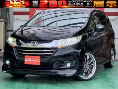 ODYSSEY   オデッセイ　G　✨大人気カスタム車両&ARROWZ 車高調新品取付済み！！✨　待望のＲＣ型のオデッセイが入庫致しました！！　純正HDDナビ地デジフルセグ&Bluetooth接続可！！　充実装備満載のＧグレード！！　7人広々と乗れる室内空間で両側パワースライドドアですので快適にお乗りいただけるお車です♪リヤエンターシステム付純正フリップダウンモニター・二列目オットマン付リクライニングシートでリラックスしたドライブが出来ますよ♪　3列目シートを格納すると広大な荷室に早変わり☆　大きいお荷物も楽々載せれます♪　社外フルエアロ＆社外4本出しマフラーがカッコよく決まってます！！　☆総合評価優良車☆